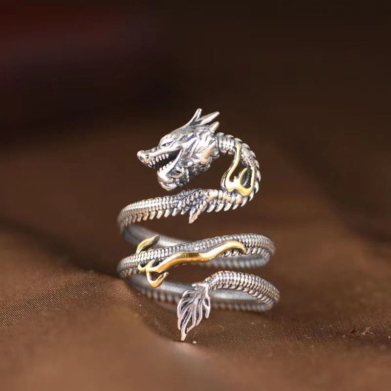 Vintage Dragon Copper Ring | Strength & Wisdom – silver dragon wrap ring with gold accents on fabric, fierce