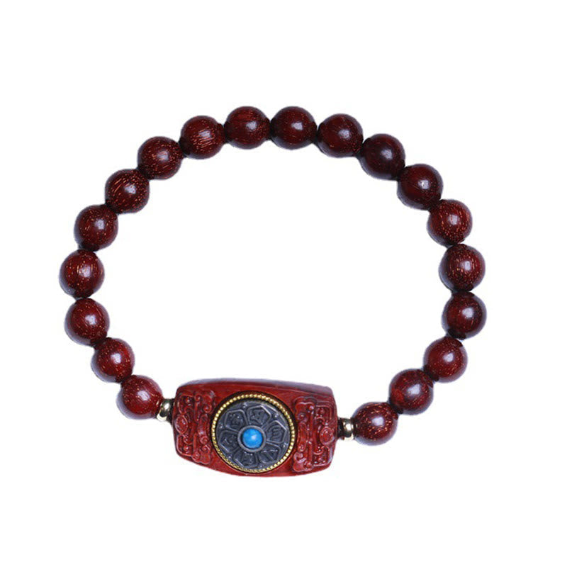 Sandalwood Six True Words Bracelet - Top-down view on white background, red beads with mantra plaque