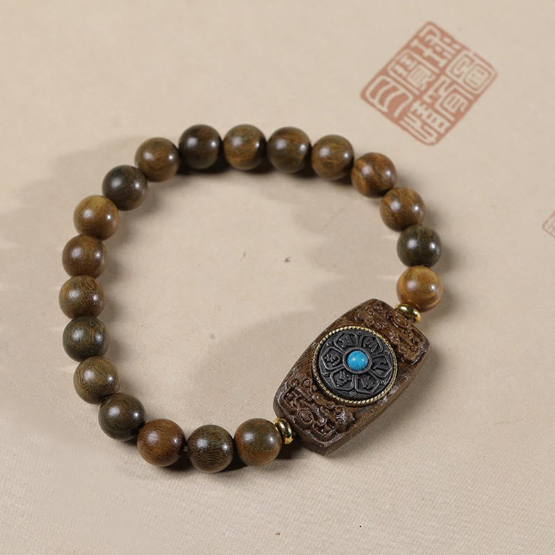 Sandalwood Six True Words Bracelet - Green-tinted sandalwood beads with blue stone mantra plaque