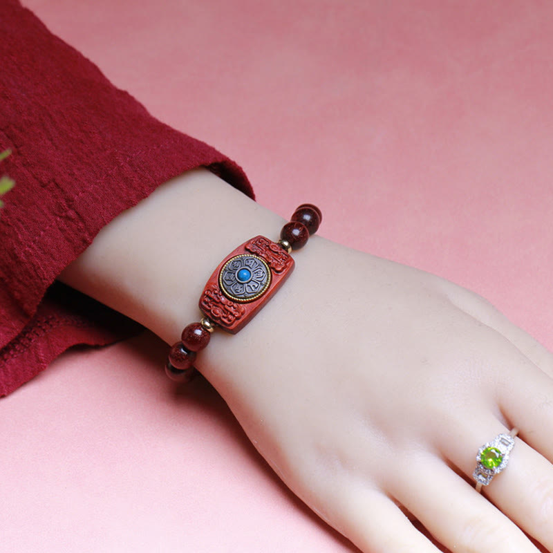 Sandalwood Six True Words Bracelet - Worn on wrist showcasing carved mantra charm, wooden bead jewelry