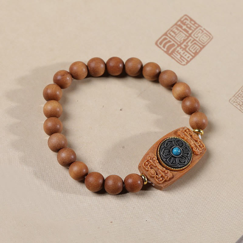 Sandalwood Six True Words Bracelet - Light wood beads with ornate Six True Words centerpiece