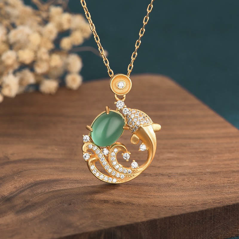 Green Chalcedony Koi Fish Necklace - gold koi pendant with green jade stone on wood with dried flowers, lucky fish jewelry