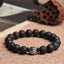 Lava Rock PiXiu Wealth Bracelet with silver bead on burlap, book and lotus pod props, volcanic stone jewelry