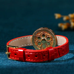 Compass Jade Leather Bracelet – gold floral cutout medallion on red crocodile-embossed band, boho jewelry