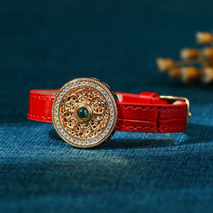 Compass Jade Leather Bracelet – ornate gold medallion with crystal halo on red embossed strap, jade bracelet