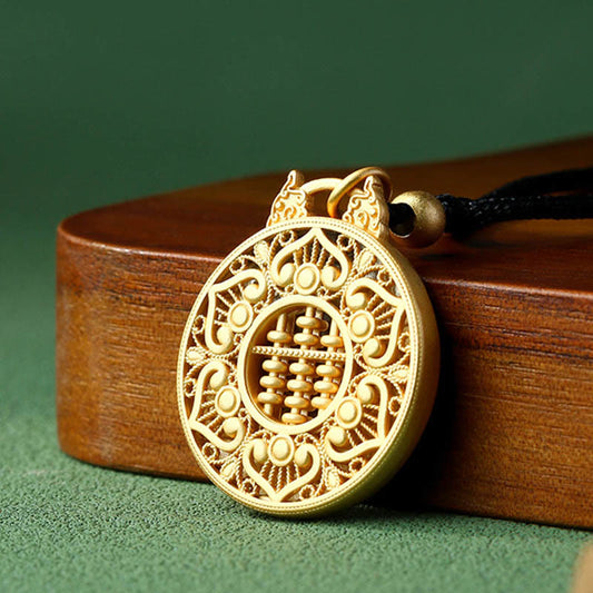 Gold Plated Copper Koi Fish Pendant – gold abacus pendant with filigree border on wooden stand, 3-quarter view