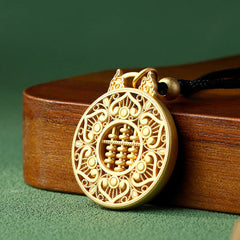 Gold Plated Copper Koi Fish Pendant – gold abacus pendant with filigree border on wooden stand, 3-quarter view