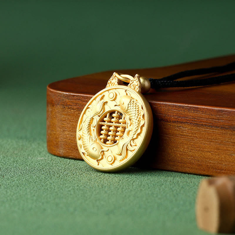 Gold Plated Copper Koi Fish Pendant – gold pendant with double koi and abacus on wooden stand, green background