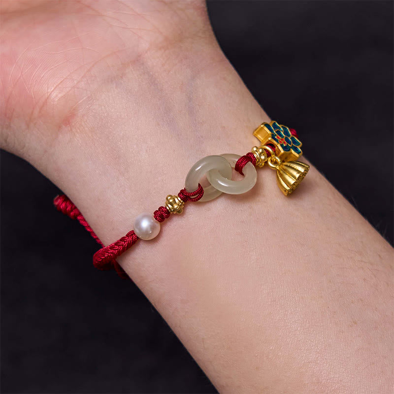 Jade Double Ring Bracelet Worn – Enamel lotus charm on wrist, red cord jade bracelet