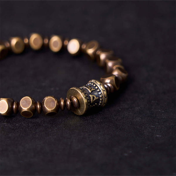 Om Mani Padme Hum Brass Bracelet - Macro of engraved prayer wheel bead with antiqued brass beads, men amulet