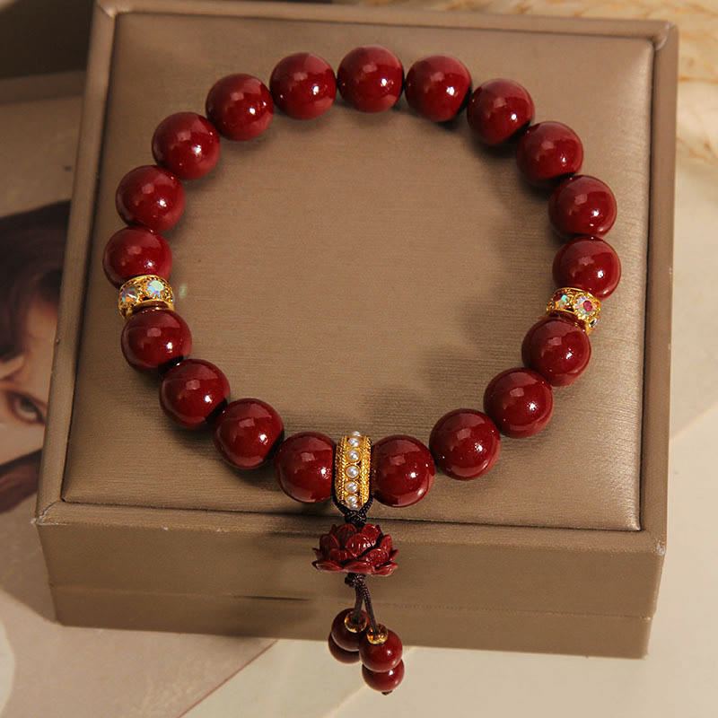 Cinnabar Red Bead Bracelet – Lotus charm tassel with pearl-inlaid gold spacers, charm bracelet