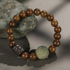 Sandalwood Jade PiXiu Bracelet with gray stone prop, carved green jade bead, hammered dark spacer, zen