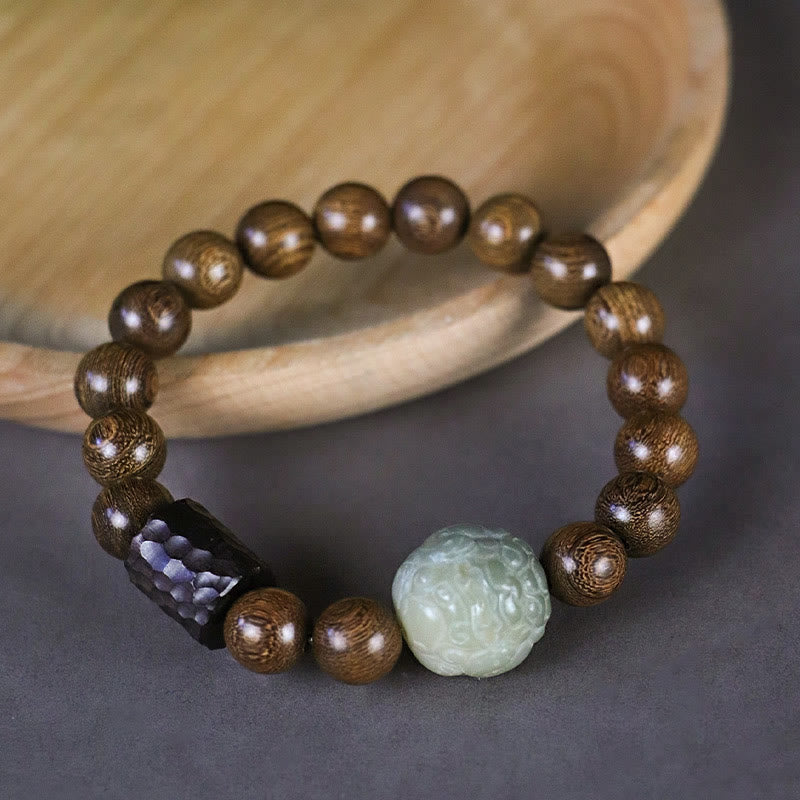 Sandalwood Jade PiXiu Healing Bracelet with wooden bowl, carved stone bead, dark faceted spacer, mindful