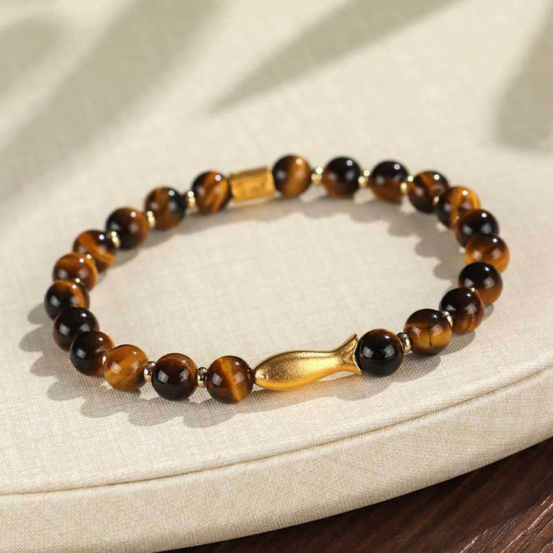 Tiger Eye Koi Fish Courage Bracelet – golden tiger eye beads with gold fish charm on cream linen, three-quarter