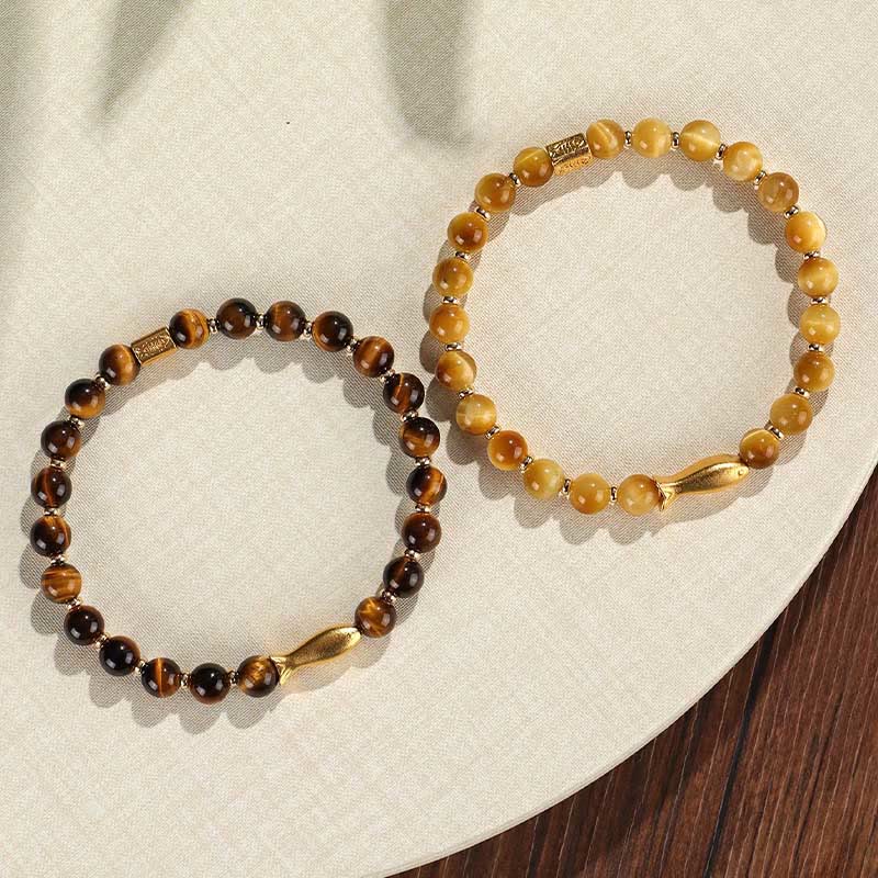 Tiger Eye Koi Fish Courage Bracelet – pair of brown and golden tiger eye with gold fish charms on cream linen