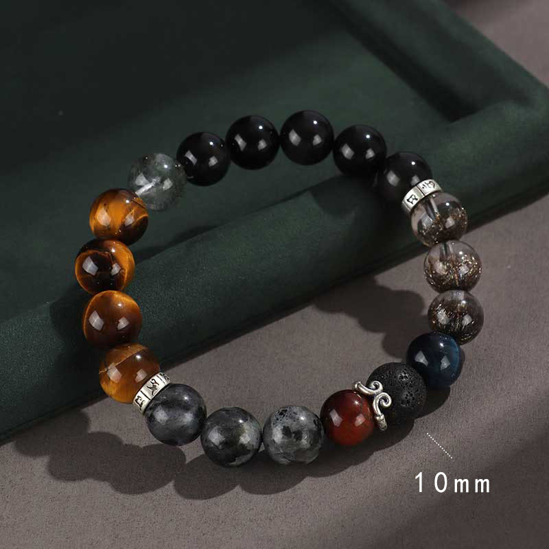 Onyx Obsidian Tiger Eye Bracelet – colorful gemstone beads with silver charm on green backdrop, chakra jewelry