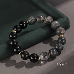 Onyx Obsidian Tiger Eye Bracelet – mixed stone beads with gold spacers on green surface, 12mm healing bracelet