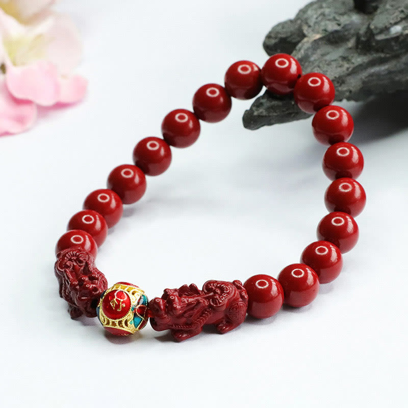 Cinnabar Pixiu Bracelet – cinnabar bead bracelet with carved pixiu and enamel accent bead, bokeh flowers