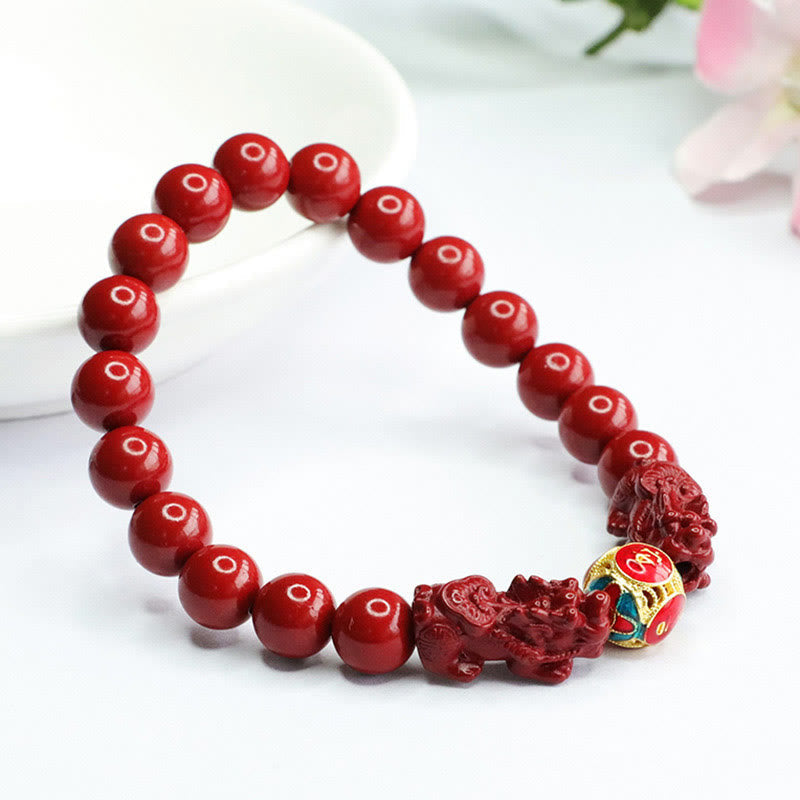 Cinnabar Double Pixiu Bracelet – red beads with carved pixiu and gold fortune bead, cherry blossom accent