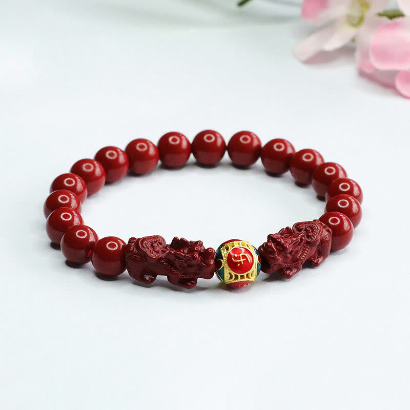 Cinnabar Pixiu Bracelet – traditional red cinnabar bracelet with pixiu and fortune bead on white surface