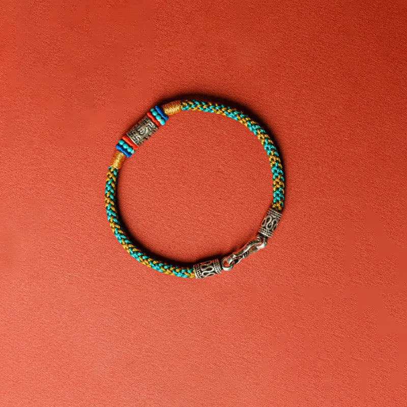 Colorful Six Words Silver Bracelet – Full braided bracelet flat lay, cord jewelry