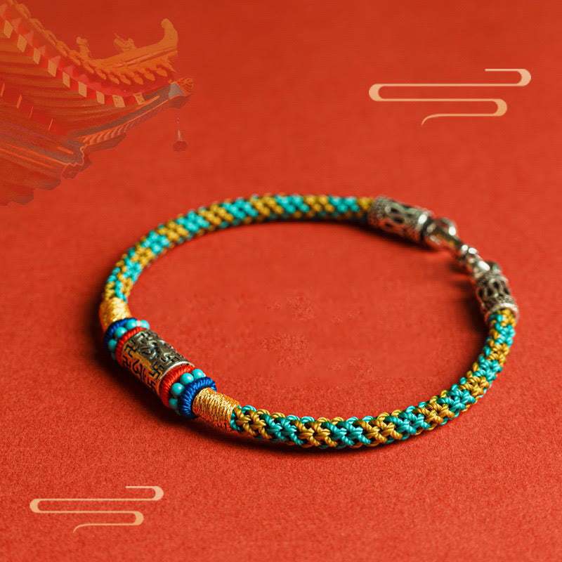 Colorful Six Words Silver Bracelet – Teal gold braid on red backdrop, ethnic