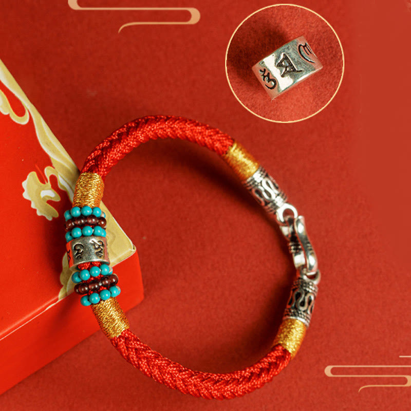 Om Mani Padme Hum Bracelet – Flat lay with gold motifs, charm