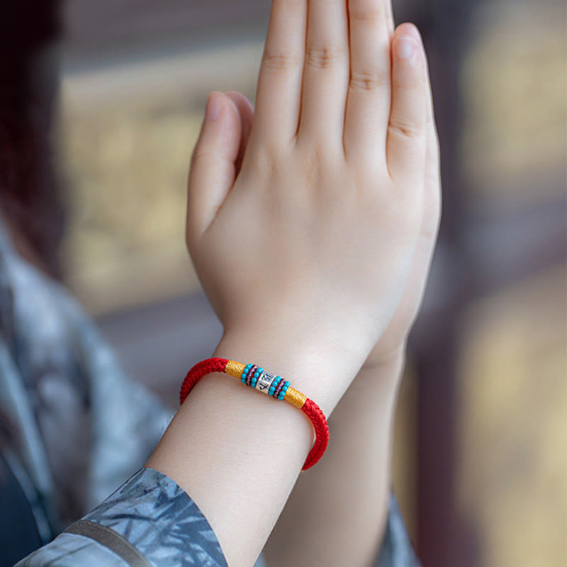 Om Mani Padme Hum Bracelet – Close-up on wrist in prayer, lucky