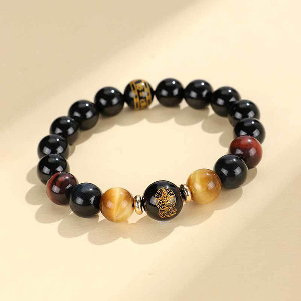 Black Onyx Tiger Eye Natal Buddha Bracelet - flat lay with gold Buddha focal bead