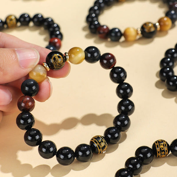 Black Onyx Tiger Eye Natal Buddha Bracelet - hand-held, gold Buddha and mantra beads