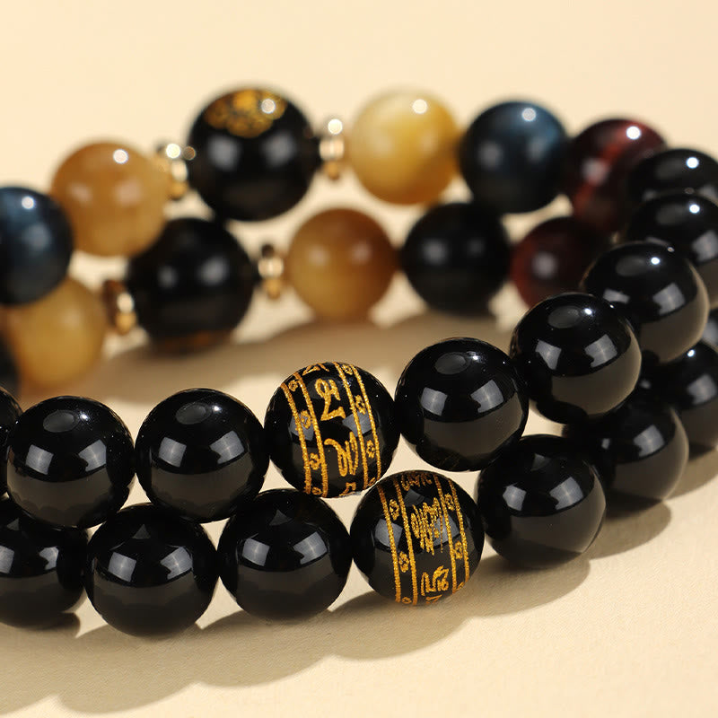 Black Onyx Tiger Eye Natal Buddha Bracelet - multi-bracelet display, gold mantra beads