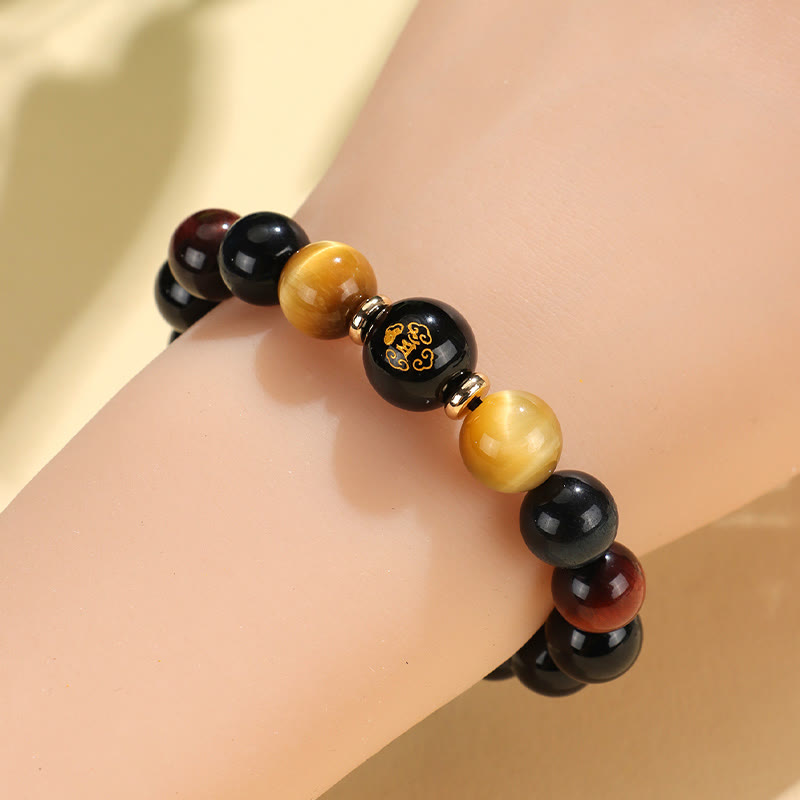 Black Onyx Tiger Eye Natal Buddha Bracelet - worn on wrist, gold zodiac focal bead