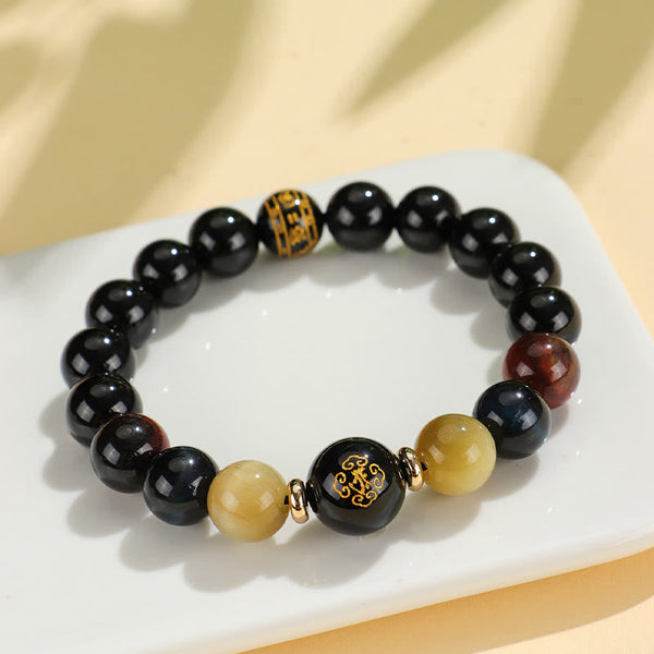 Black Onyx Tiger Eye Natal Buddha Bracelet - on ceramic dish, gold inscribed black beads