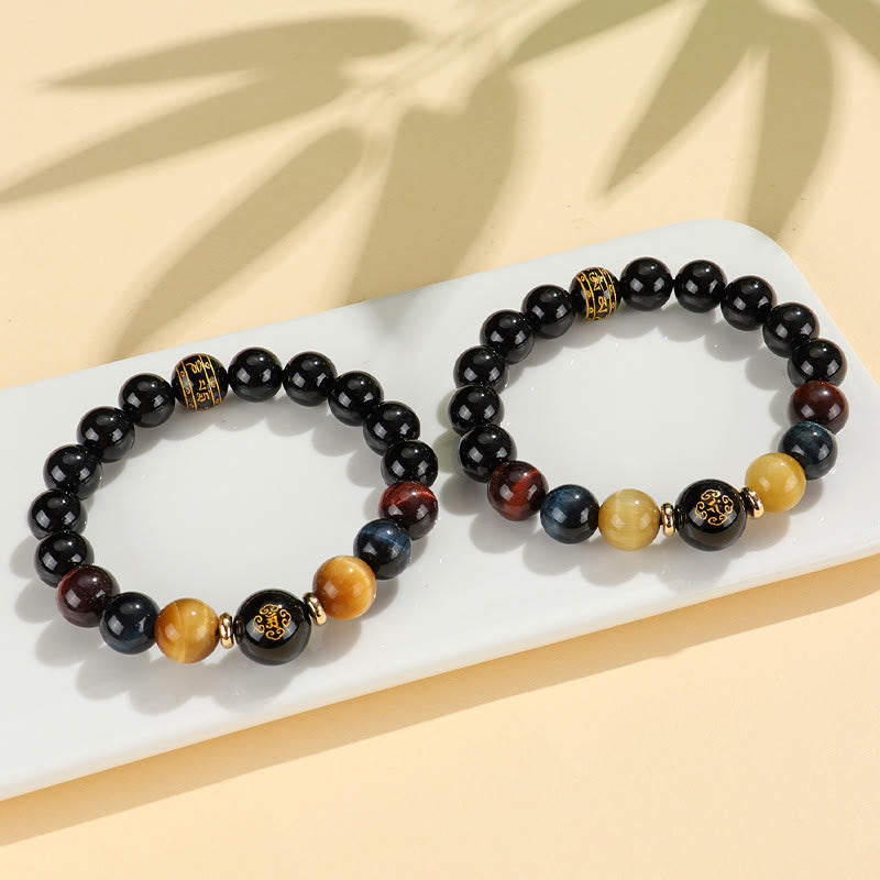 Black Onyx Tiger Eye Natal Buddha Bracelet - paired display, gold character accent beads