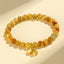 Tiger Eye Fu Bamboo Koi Lotus Bracelet – yellow jade beads with persimmon and flower gold charms on cream bg