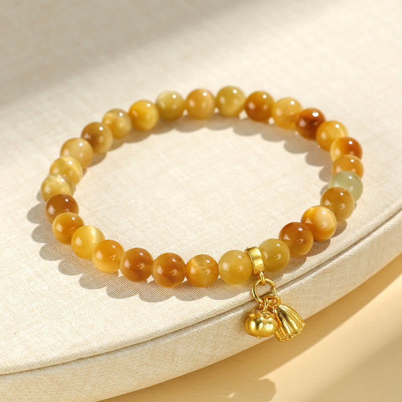 Tiger Eye Fu Bamboo Koi Lotus Bracelet – honey jade beads with pumpkin and lotus pod gold charms on linen fabric