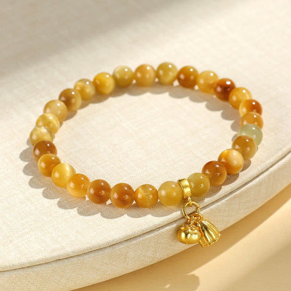 Tiger Eye Fu Bamboo Koi Lotus Bracelet – honey jade beads with pumpkin and lotus pod gold charms on linen fabric