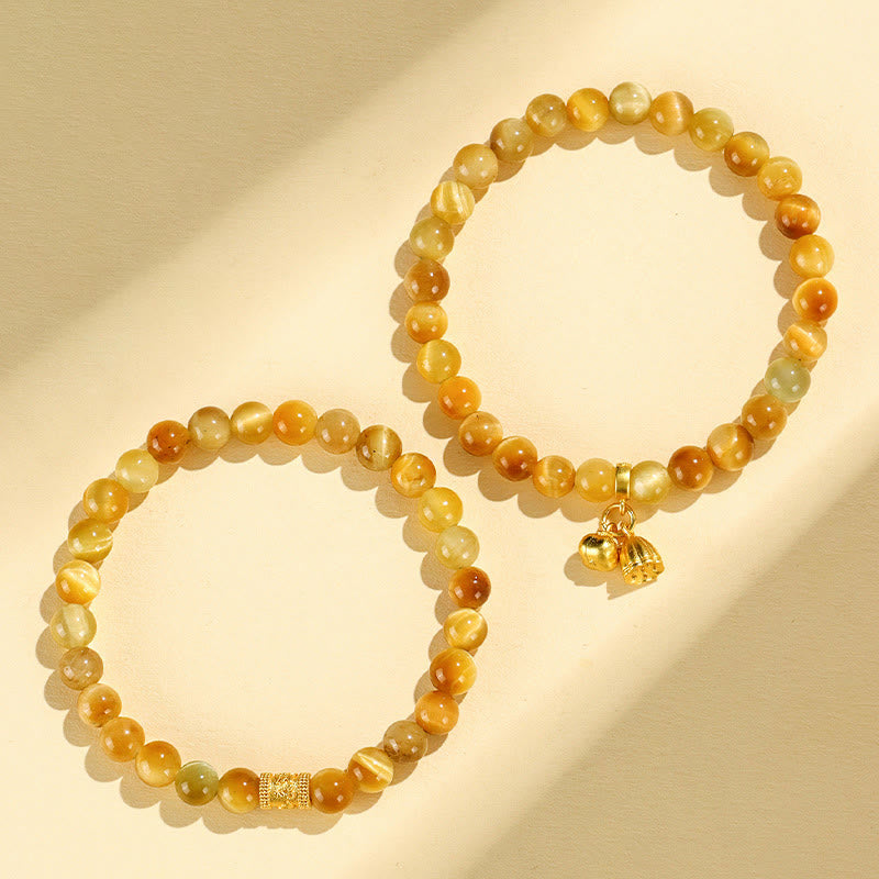 Tiger Eye Fu Bamboo Koi Lotus Bracelet – pair of tiger eye bracelets interlocked infinity on cream, gold charms