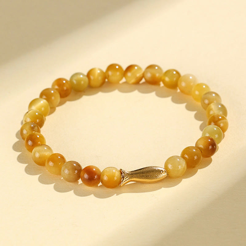 Tiger Eye Fu Bamboo Koi Lotus Bracelet – tiger eye beads with gold fish charm on cream, flat lay, prosperity
