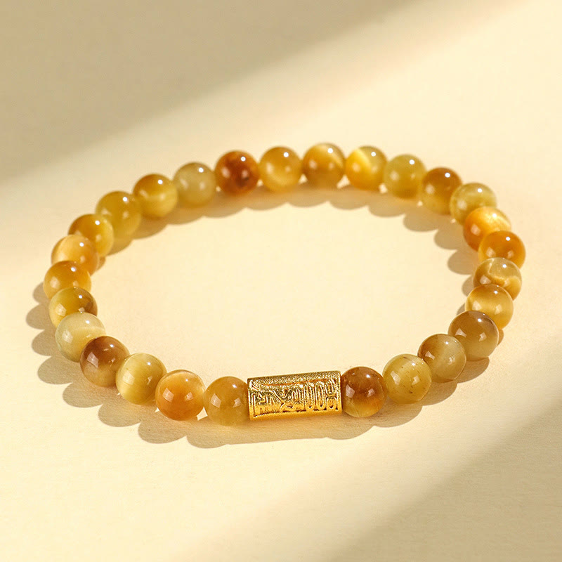 Tiger Eye Fu Bamboo Koi Lotus Bracelet – tiger eye beads with engraved gold barrel charm on cream, warm tones