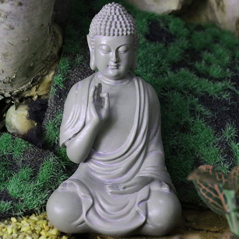 Small Meditation Prayer Resin Buddha Statue – on bedside table with soft lamp light, bedroom calming atmosphere accent
