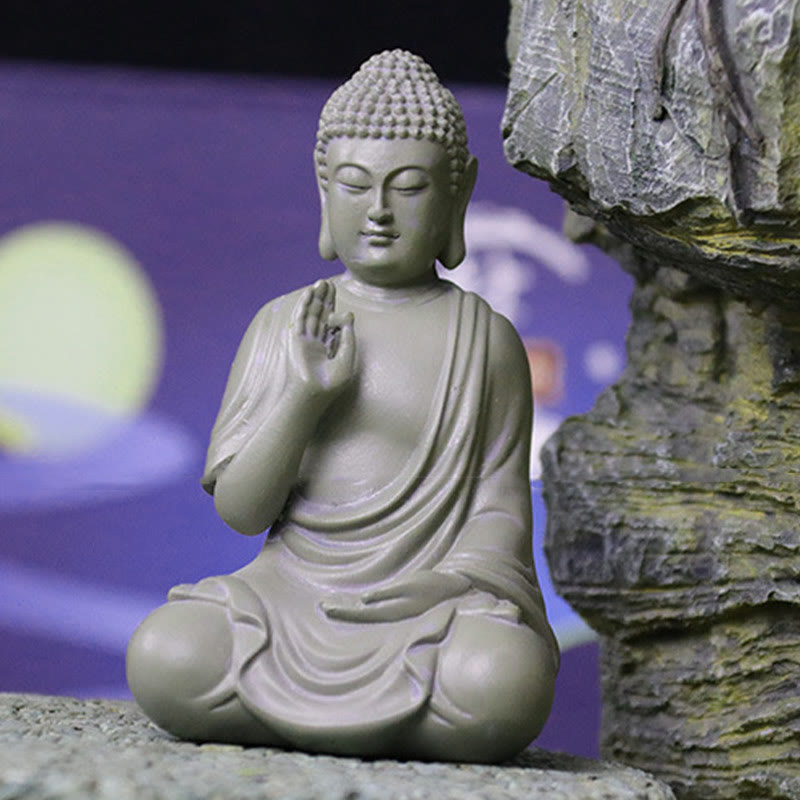 Small Meditation Prayer Resin Buddha Statue – on wooden desk with notebook, workspace mindfulness reminder decor