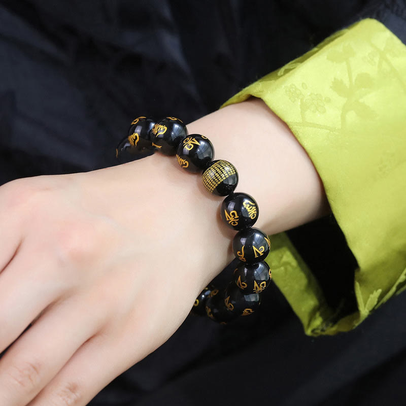 Rainbow Obsidian Mantra Bracelet - Worn on wrist showing gold mantra beads, mindfulness jewelry