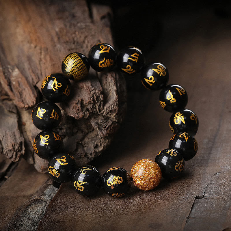 Rainbow Obsidian Mantra Bracelet - Black obsidian beads with gold Sanskrit on weathered wood, zen bracelet