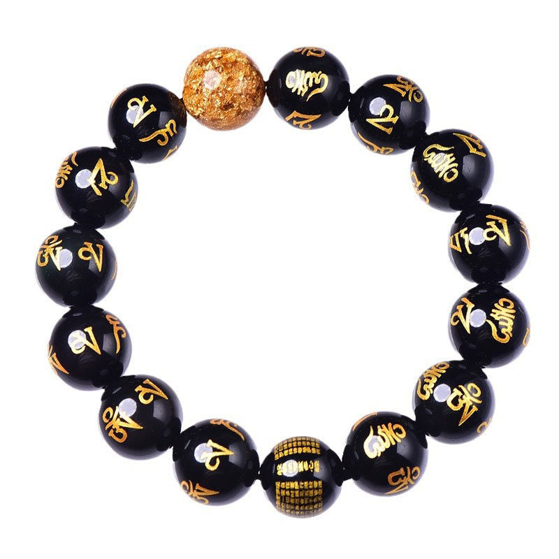 Rainbow Obsidian Mantra Bracelet - Overhead view of gold-inscribed obsidian beads, prayer bead bracelet
