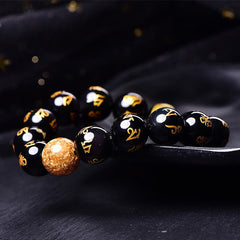Rainbow Obsidian Mantra Bracelet - Textured gold accent bead with mantra-engraved obsidian, healing bracelet