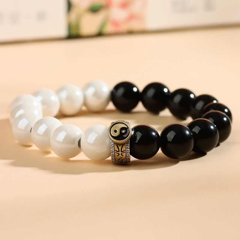 Black Obsidian White Porcelain Yin Yang Bracelet - Arc-shaped black and white bracelet with bronze yin-yang bead, zen energy bracelet