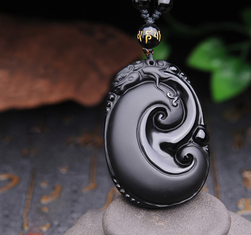 Black Obsidian PiXiu Pendant – Oval carved swirl obsidian with PiXiu head on beaded cord