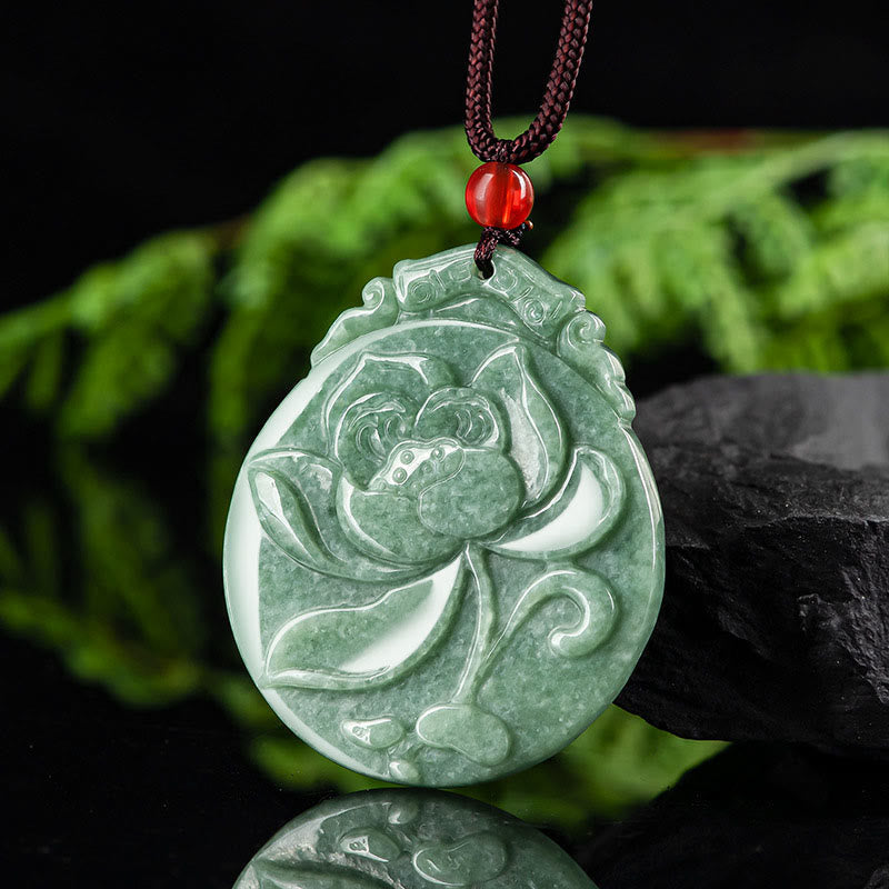 Round Lotus Jade Necklace - angled view on reflective surface with stone, natural elegance