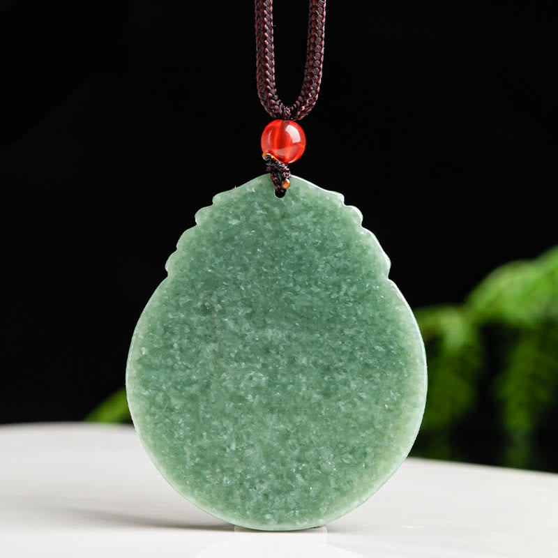 Round Lotus Jade Necklace - jade lotus on white surface with dark background, prosperous